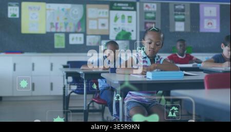 Writing girl wearing purple polo, denim shorts, focusing on blue workbook in school, with CO2 icons Stock Photo