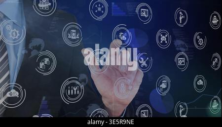 Selecting suited right hand tapping holographic icons at dashboard, in suit jacket and striped tie Stock Photo