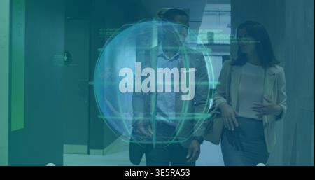 Walking two professionals in blazers discussing in office hall with HUD globe overlaying and watch Stock Photo