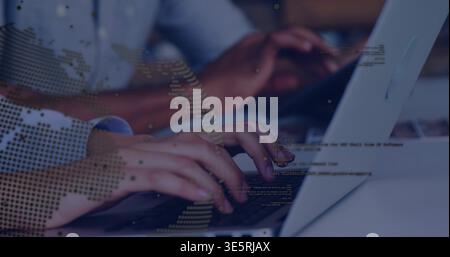 Typing hands pressing laptop keyboards at office desk, showing cuff and world map overlay with code Stock Photo