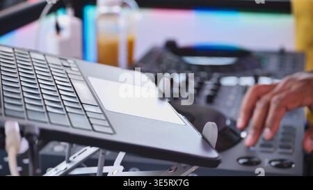 DJ mixing music at India Day Moscow festival with laptop and sound controller Stock Photo