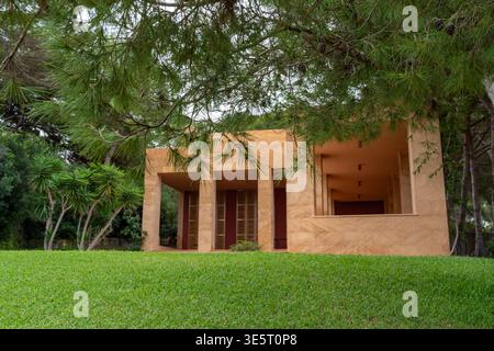 Lush green lawn in front of modern tropical house Stock Photo