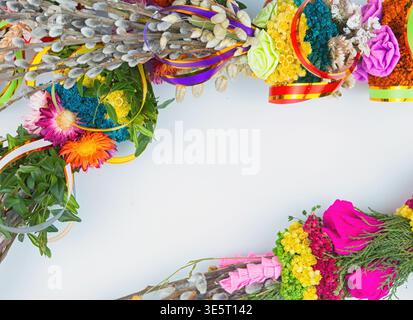 Easter eggs and willow branches on a white background Stock Photo