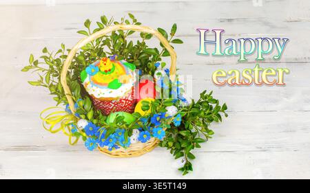 Easter composition. decorated with Easter bread and Easter eggs on the table decorated with herbs and chocolate hare Stock Photo