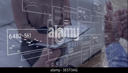 Reviewing data, team in business attire collaborating on laptop in office lounge, notebook pen HUD Stock Photo