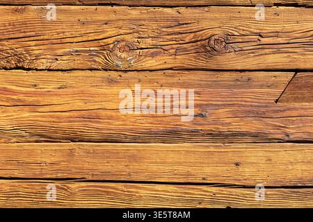 Weathered old wooden planks texture, horizontal rough aged wood surface background with knots and cracks Stock Photo