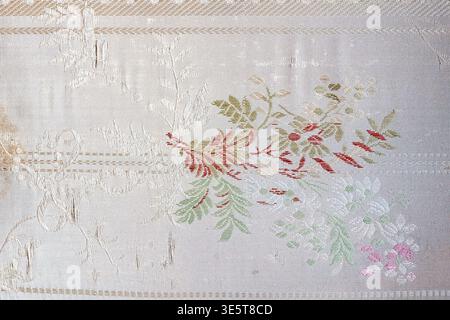 Vintage white floral brocade fabric texture, aged cream upholstery textile surface background with woven flower pattern Stock Photo