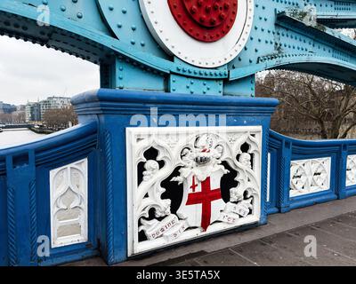 Close-up view of Tower Bridge decorative crest and painted ironwork along the Thames in London, UK. Stock Photo