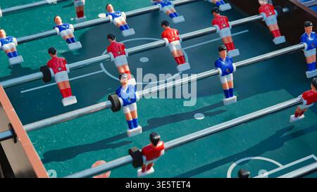 Table football game with red and blue miniature players Stock Photo