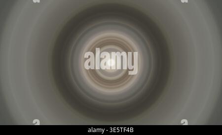 Abstract radial blur of concentric circles fading outwards from a bright center Stock Photo