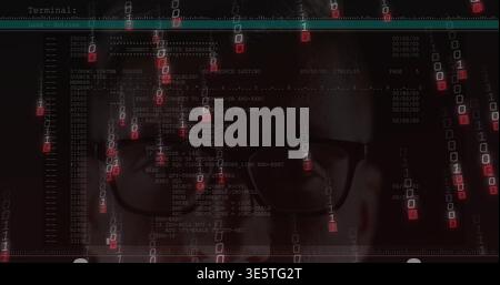 Peering mid-adult male wearing rectangular specs scanning terminal output on monitor with green bar Stock Photo