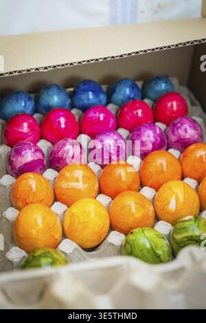 Close-up of colorful Easter eggs in a cardboard box, Easter campaign, Sindelfingen, Boeblingen district, Germany Stock Photo