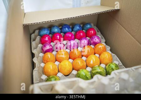Colourful Easter eggs in an opened cardboard box, Easter campaign, Sindelfingen, Boeblingen district, Germany Stock Photo