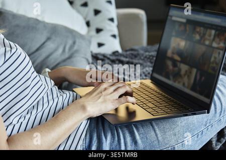 Working from home concept. Woman jands typing on laptop keyboard. Remote work from home workplace Stock Photo