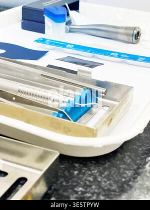 A set of dental tools in a tray on a white background Stock Photo