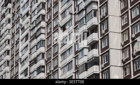 Moscow brutalist architecture featuring many windows, balconies, and air conditioners Stock Photo