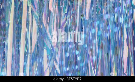 Iridescent holographic tinsel curtain with shimmering blue and pink light reflections Stock Photo