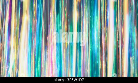 Iridescent tinsel background creating a holographic and shimmering abstract texture Stock Photo
