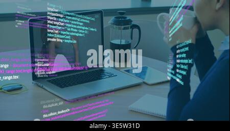 Holding mug, navy-sweater woman sipping while viewing laptop code overlay at desk, copy space Stock Photo