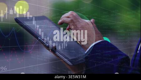 Tapping woman's cuffed hands in navy suit swiping black tablet by plants, showing market charts Stock Photo