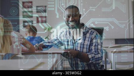 Smiling teacher in checked shirt holding tablet, guiding two students in classroom with AR overlay Stock Photo