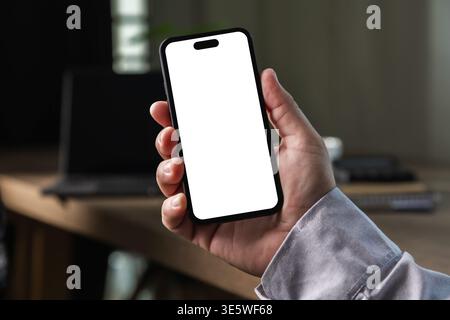 hand holding smartphone mockup with blank screen for mobile app design, digital marketing presentation, user interface display, product showcase, busi Stock Photo