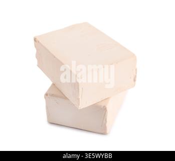 Blocks of fresh yeast on white background Stock Photo