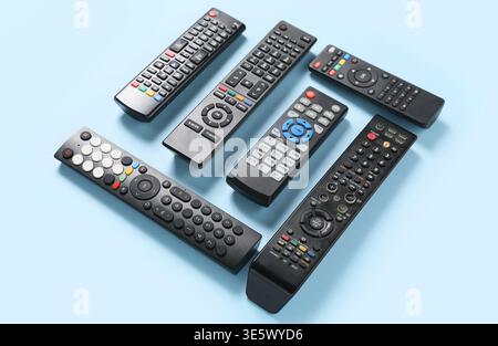 Different modern TV remote controls on blue background Stock Photo
