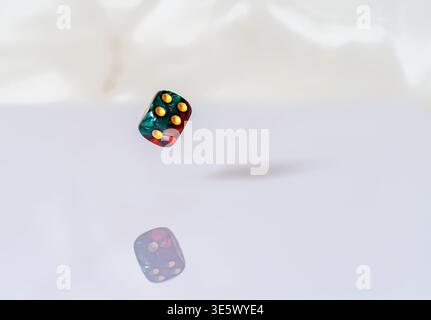 Floating magical dice with reflection Stock Photo