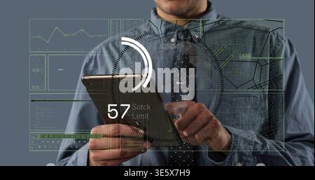 Steadying metal tablet, man in blue shirt, tie tapping HUD showing 57 Stock Limit in studio Stock Photo