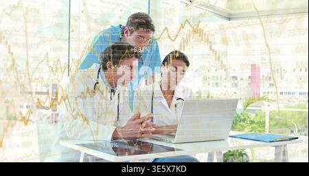 Discussing three doctors typing on laptop in clinic, wearing lab coats, showing financial charts Stock Photo