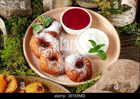donuts in powdered sugar and jam Stock Photo