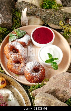 donuts in powdered sugar and jam Stock Photo