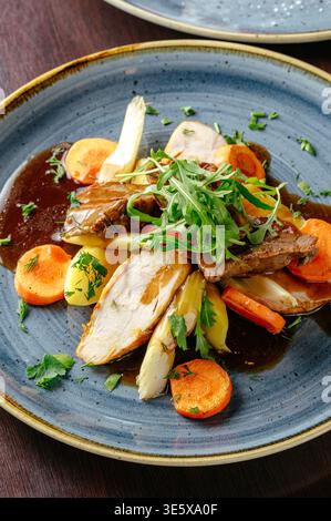 stewed vegetables with meat and arugula Stock Photo