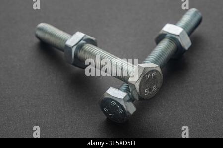 construction bolts close-up on a black background Stock Photo