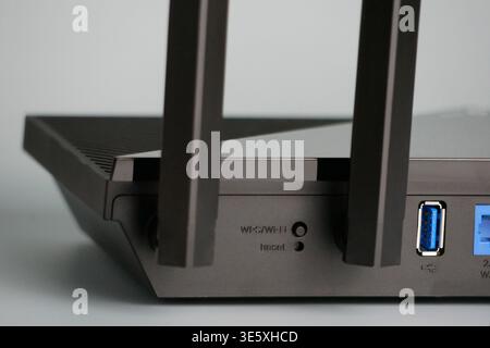 Close up of wireless wi-fi router with antennas and channel isolated on white background. High speed internet connection, computer network and telecom Stock Photo