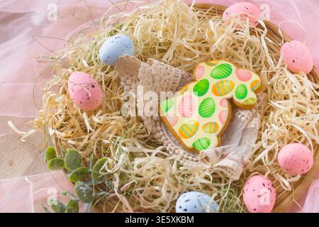 Easter holiday composition with decorated cookie eggs and spring festive background Stock Photo