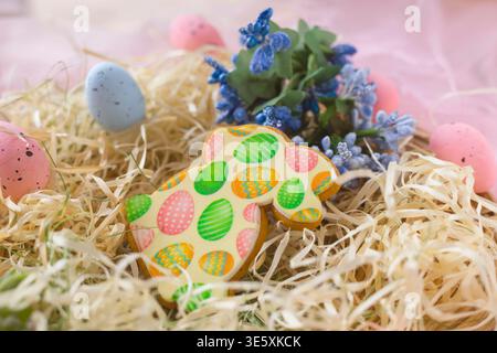 Easter holiday composition with decorated cookie eggs and spring festive background Stock Photo