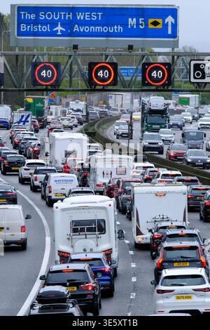Bristol, UK. 3rd Apr, 2026. As fuel prices climb the Easter Getaway causes traffic congestion on the M5 between junctions 15/16 and 17 at Bristol. Managed motorway speed restrictions are in place due to the volume of traffic heading south towards Devon and Cornwall. Highways England reports speeds below 20 mph. Credit: JMF News/Alamy Live News Stock Photo