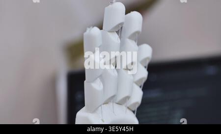 3D printing white robotic prosthesis hand in a technology exhibition Stock Photo
