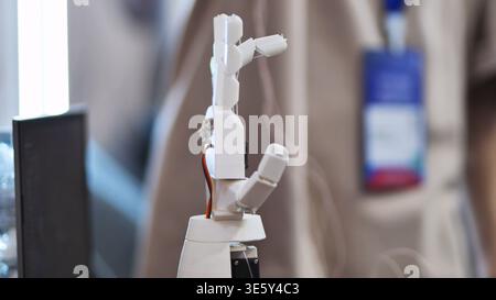 Close up of a white robotic hand prototype in a modern technology laboratory or exhibition Stock Photo