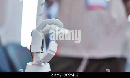 Articulated robotic hand prototype gesturing with shallow depth of field Stock Photo