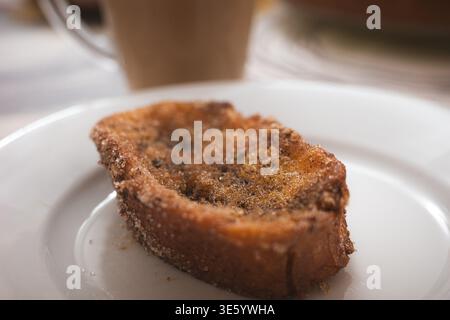 Spanish torrijas dessert on white plate close up Stock Photo