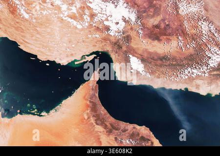 Satellite view of the Strait of Hormuz, connecting the Persian Gulf and Gulf of Oman. High-resolution orbital image featuring arid desert landscapes, Stock Photo