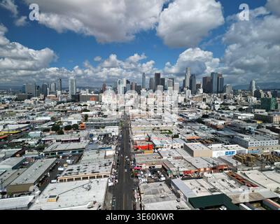 Aerial view over the industrial and commercial area south of downtown Los Angeles under blue sky with puffy clouds Stock Photo