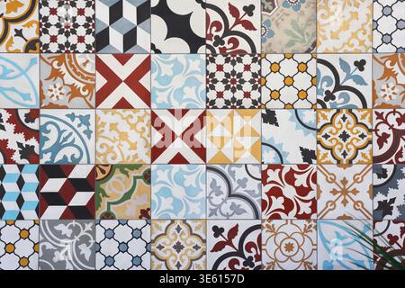 Colorful background of seamless patchwork ceramic tiles with various geometric and floral mediterranean patterns. Traditional azulejo style texture. Stock Photo
