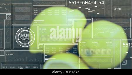 Showing blurred lime-green leaves floating in studio, displaying white HUD overlays and readouts Stock Photo