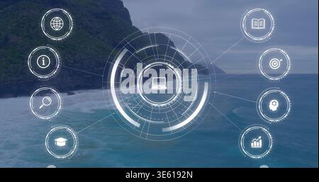 Projecting central hologram interface with laptop icon over coastal cliff, showing eight node icons Stock Photo