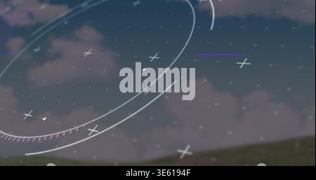 Displaying translucent circular HUD overlay across twilight sky above grassy hill, showing arcs Stock Photo