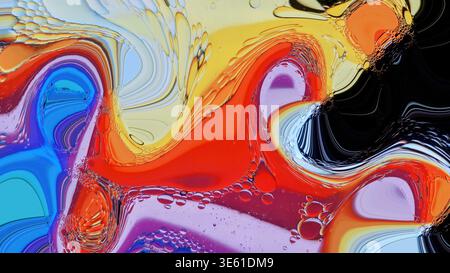 Colorful oil blobs creating an abstract wavy pattern and textured surface Stock Photo